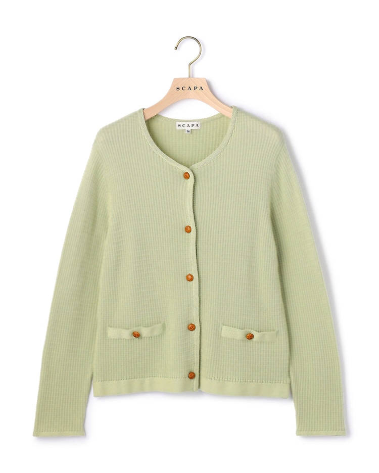 グリーンのニット