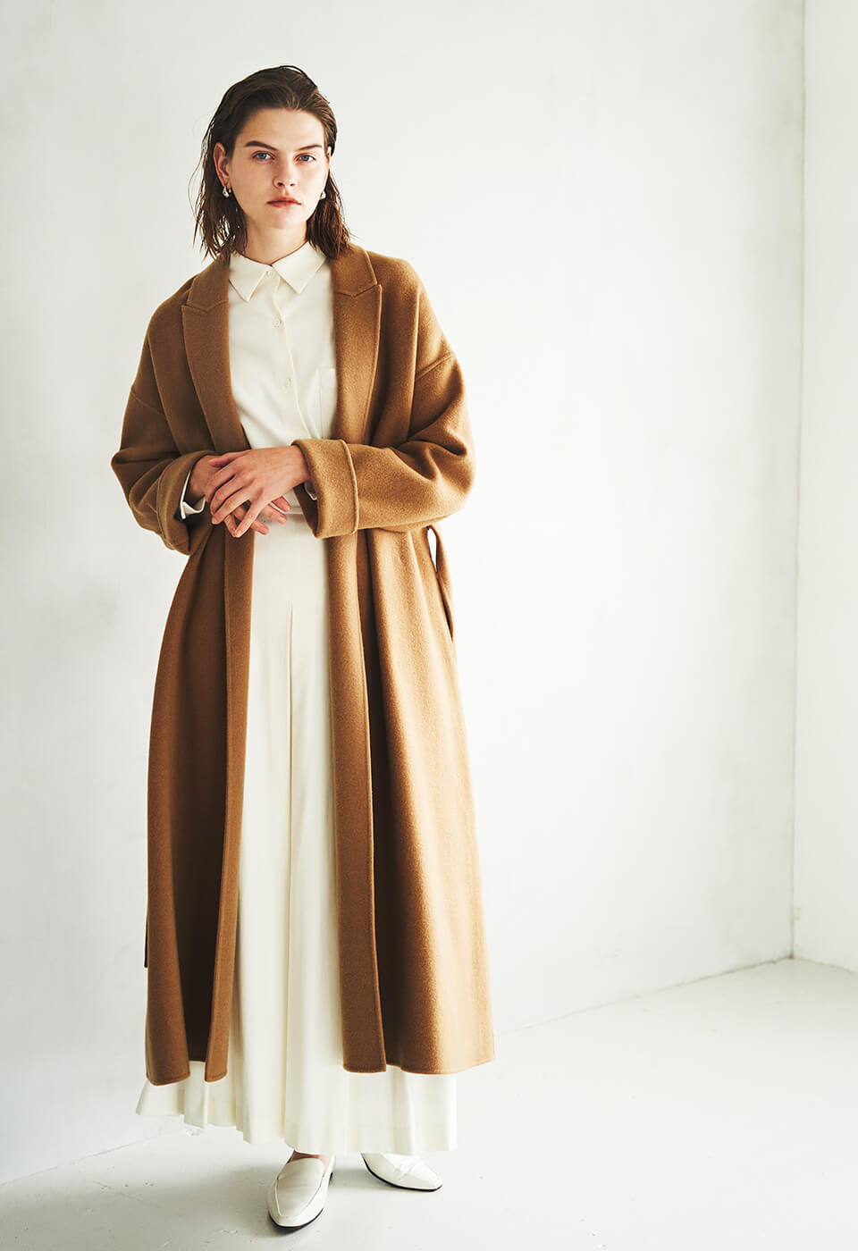 White shirt dress and camel coat with snakeskin boots